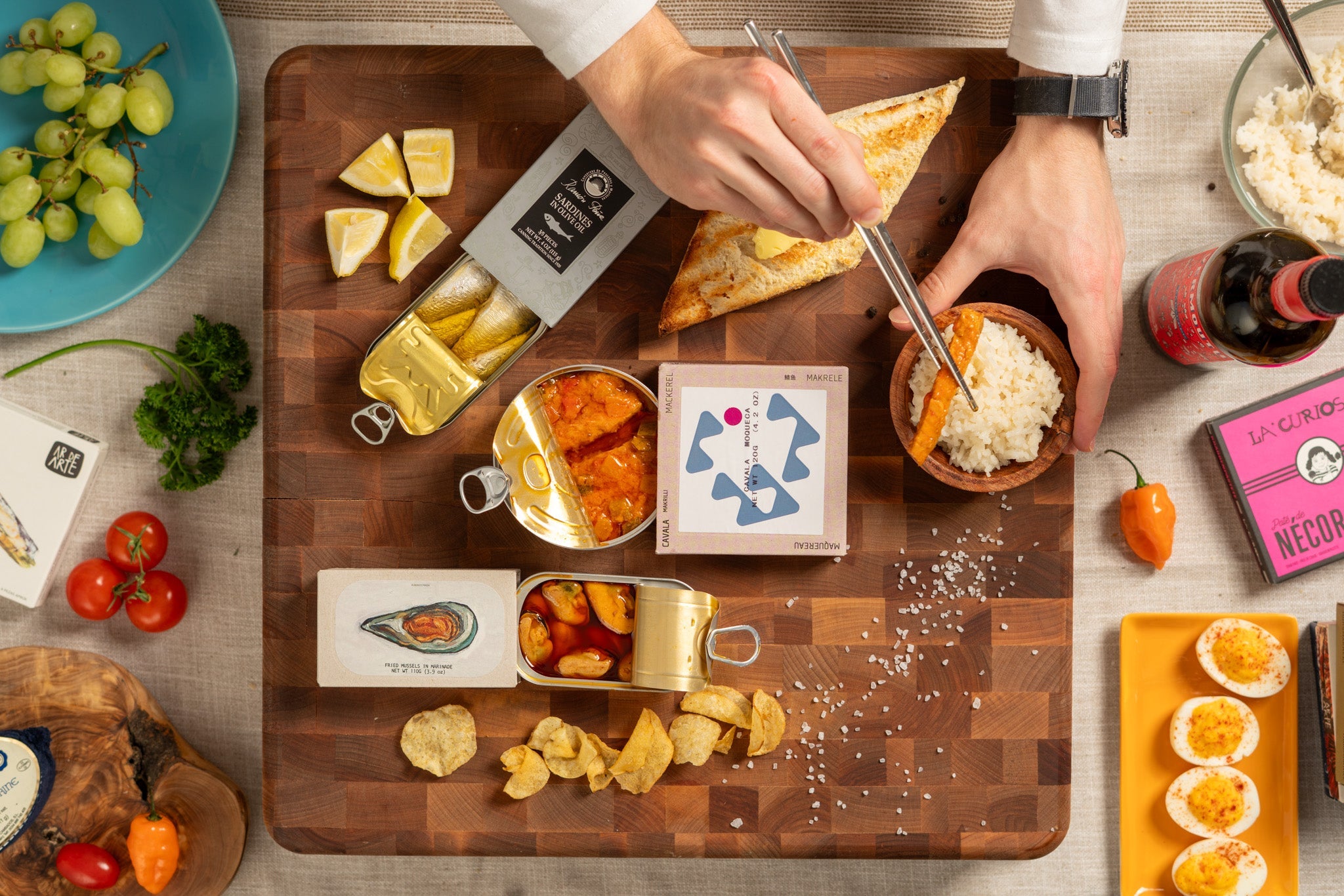 Tinned Fish Charcuterie Board With Arrangement Of Open Tins And Snacks